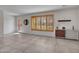 Stylish living room featuring tile floors, natural light, and elegant modern furnishings at 8450 E Montecito Ave, Scottsdale, AZ 85251