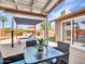 Covered patio with outdoor dining, lounge chairs and backyard view of pool at 8450 E Montecito Ave, Scottsdale, AZ 85251