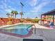 Backyard pool and spa area with red brick trim, lounge chairs, grill and privacy fence at 8450 E Montecito Ave, Scottsdale, AZ 85251