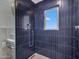 Modern shower with a tiled surround and window at 8450 E Montecito Ave, Scottsdale, AZ 85251