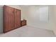 Simple bedroom with a murphy bed and dresser at 17963 W Ryans Way, Surprise, AZ 85374