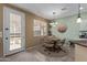 Charming dining area with a table and four chairs at 17963 W Ryans Way, Surprise, AZ 85374