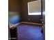 Empty bedroom with window and purple floor at 22744 E Carla Vista Dr, Mesa, AZ 85212