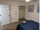 Bedroom with double bed, closet, and decorative wall art at 418 W Hartford Rd, Kearny, AZ 85137