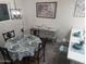 Charming dining area with table and chairs, decorated in blue and white at 418 W Hartford Rd, Kearny, AZ 85137