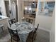 Dining area with a table set for four and a view into the living room at 418 W Hartford Rd, Kearny, AZ 85137