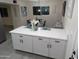 Kitchen island with white cabinets and quartz countertops at 418 W Hartford Rd, Kearny, AZ 85137