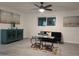 Living room featuring gray tile floors, a ceiling fan, and modern decor at 418 W Hartford Rd, Kearny, AZ 85137