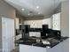 Modern kitchen with quartz counters and stainless steel appliances at 647 N Cambridge St, Gilbert, AZ 85233