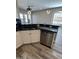 View of kitchen sink and stainless steel dishwasher with hanging lighting at 647 N Cambridge St, Gilbert, AZ 85233