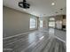 Open living room with wood floors and connecting dining area at 647 N Cambridge St, Gilbert, AZ 85233