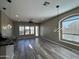 Bright living room with wood floors and modern light fixture at 647 N Cambridge St, Gilbert, AZ 85233