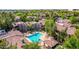 This condo community features lush landscaping and a refreshing pool with lounge chairs at 15380 N 100Th St # 1106, Scottsdale, AZ 85260