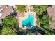 Aerial view showcases a community pool with lounge chairs and umbrellas at 15380 N 100Th St # 1106, Scottsdale, AZ 85260