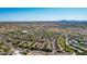 Overhead view of a sprawling residential community with dense greenery and a mix of single and multi-Gathering homes at 15380 N 100Th St # 1106, Scottsdale, AZ 85260