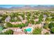 Aerial view showcasing the pool, lush landscaping and mountain views of this community at 15380 N 100Th St # 1106, Scottsdale, AZ 85260