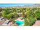 This condo community features lush landscaping and a refreshing pool with lounge chairs at 15380 N 100Th St # 1106, Scottsdale, AZ 85260