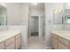 Bathroom has dual sinks, a walk-in shower and walk-in closet at 15380 N 100Th St # 1106, Scottsdale, AZ 85260