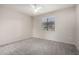 Bright bedroom featuring neutral walls, plush carpeting, ceiling fan and a window with natural light at 15380 N 100Th St # 1106, Scottsdale, AZ 85260