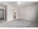 The bedroom has neutral colored carpet and a bathroom off to the side at 15380 N 100Th St # 1106, Scottsdale, AZ 85260