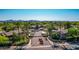 Well-manicured community entrance with lush greenery, palm trees, and a gated entry, offering a secure and welcoming feel at 15380 N 100Th St # 1106, Scottsdale, AZ 85260