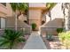 Condominium exterior with desert landscaping, multiple levels, and private entrances at 15380 N 100Th St # 1106, Scottsdale, AZ 85260
