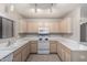 Bright kitchen with white appliances and light-colored cabinets at 15380 N 100Th St # 1106, Scottsdale, AZ 85260