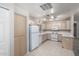 Bright kitchen featuring classic white appliances and ample cabinet space at 15380 N 100Th St # 1106, Scottsdale, AZ 85260