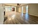 Open living area with wood-look floors and kitchen view at 10115 W Southern Ave, Tolleson, AZ 85353