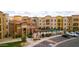 Beautiful aerial view of the condos, pool area, parking, and community landscaping at 14575 W Mountain View Blvd # 11113, Surprise, AZ 85374