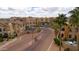 Beautiful condos at the community entrance with lush landscaping and community gate at 14575 W Mountain View Blvd # 11113, Surprise, AZ 85374