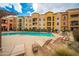 Stunning community pool with plenty of space for relaxing and enjoying the outdoors at 14575 W Mountain View Blvd # 11113, Surprise, AZ 85374