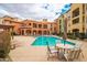 Gorgeous community pool with lounge chairs and seating area available to residents at 14575 W Mountain View Blvd # 11113, Surprise, AZ 85374