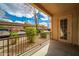 View from the condo patio showing convenient covered parking for residents and desert landscaping at 14575 W Mountain View Blvd # 11113, Surprise, AZ 85374