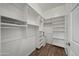 Walk-in closet with custom shelving and ample storage space at 14575 W Mountain View Blvd # 11113, Surprise, AZ 85374