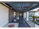 Covered entry of a stylish home, showcasing modern accents and stone landscaping at 5038 W Echo Ln, Glendale, AZ 85302