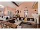 Unique living space featuring a sunken seating area, stone accents, and a bright, open layout at 5038 W Echo Ln, Glendale, AZ 85302