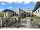 Contemporary home with a gated entrance and manicured desert landscape at 11946 E Cavedale Dr, Scottsdale, AZ 85262
