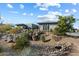 Desert landscaped home with rocks and desert vegetation at 11946 E Cavedale Dr, Scottsdale, AZ 85262