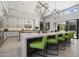 Bright kitchen features bar seating, modern pendant lights, and stainless steel appliances at 11946 E Cavedale Dr, Scottsdale, AZ 85262