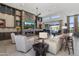 Open-concept living room boasts custom built-ins, fireplace, and sliding doors to the outdoor space at 11946 E Cavedale Dr, Scottsdale, AZ 85262