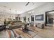 Comfortable living room with plush blue sectional, modern décor, and stylish area rug at 11946 E Cavedale Dr, Scottsdale, AZ 85262