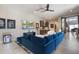 The living room has recessed lighting and a comfortable blue sofa, providing a relaxing ambiance at 11946 E Cavedale Dr, Scottsdale, AZ 85262