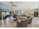 Bright and airy living room with high ceilings, piano, and sliding doors offering seamless outdoor living at 11946 E Cavedale Dr, Scottsdale, AZ 85262