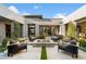 Modern patio area with a fire pit and comfortable lounge seating at 11946 E Cavedale Dr, Scottsdale, AZ 85262