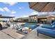Stunning backyard pool with a waterfall feature and lounge area perfect for outdoor entertaining at 11946 E Cavedale Dr, Scottsdale, AZ 85262