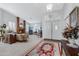 Bright living room with fireplace, hardwood floors, and large windows at 14799 W Devlin Dr, Goodyear, AZ 85395