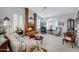 Living room with brick fireplace, hardwood floors, and seating area at 14799 W Devlin Dr, Goodyear, AZ 85395