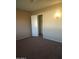 Bedroom featuring neutral walls and carpet floors at 18001 N 99Th Dr, Sun City, AZ 85373