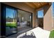 A bedroom view from the outside with a landscape view through the sliding glass door at 28171 N 95Th St, Scottsdale, AZ 85262